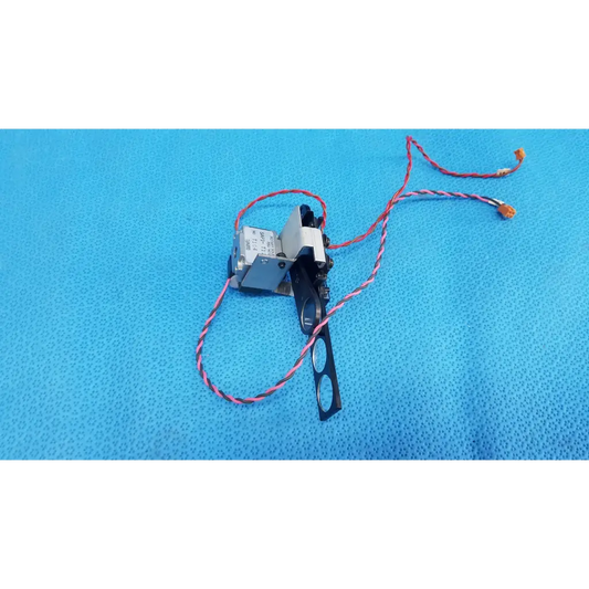 Silver and black takano sap1-t115a rotary solenoid optical lens filter slider assembly with red and white wires
