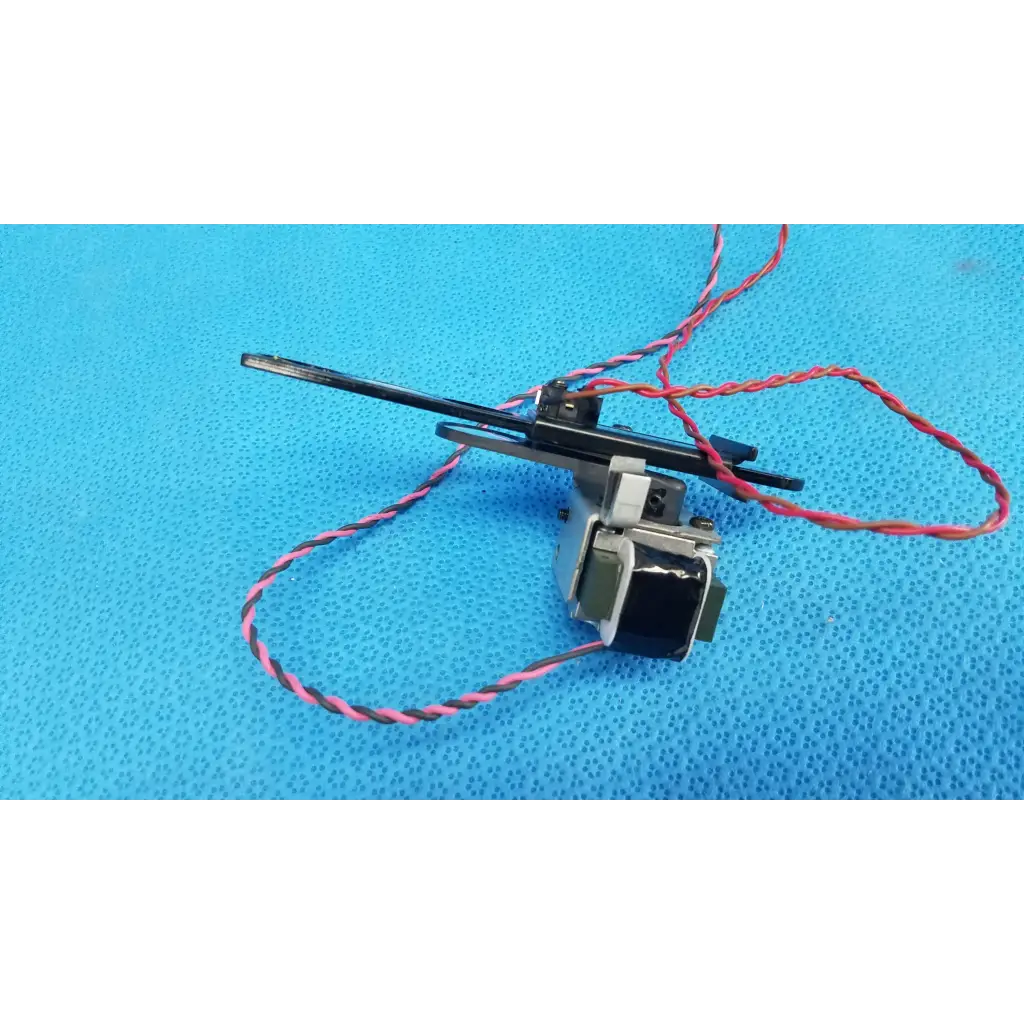 Black and silver Takano SAP1-T115A rotary solenoid optical filter slider with red and black twisted wires for Topcon camera