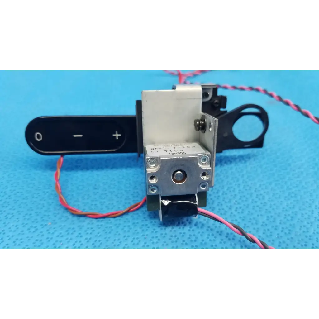 Silver metallic takano sap1-t115a rotary solenoid optical filter slider with black housing and red-black wiring for retinal camera