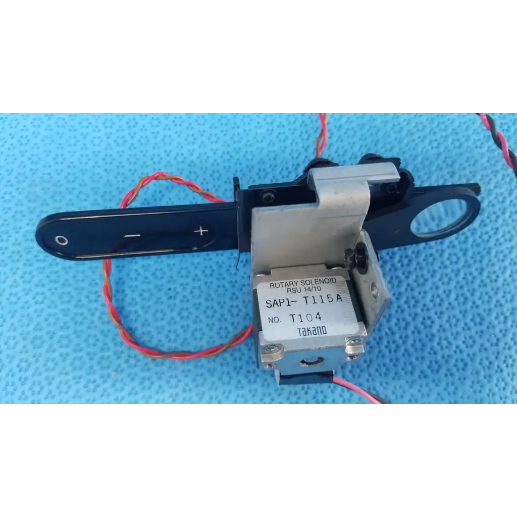 Takano sap1-t115a rotary solenoid optical lens filter slider with black handle and red-and-white wiring for retinal camera