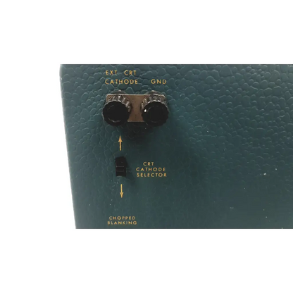 Teal textured plastic panel with two black knobs and toggle switch on tektronix 564 storage oscilloscope 3a1 dual trace