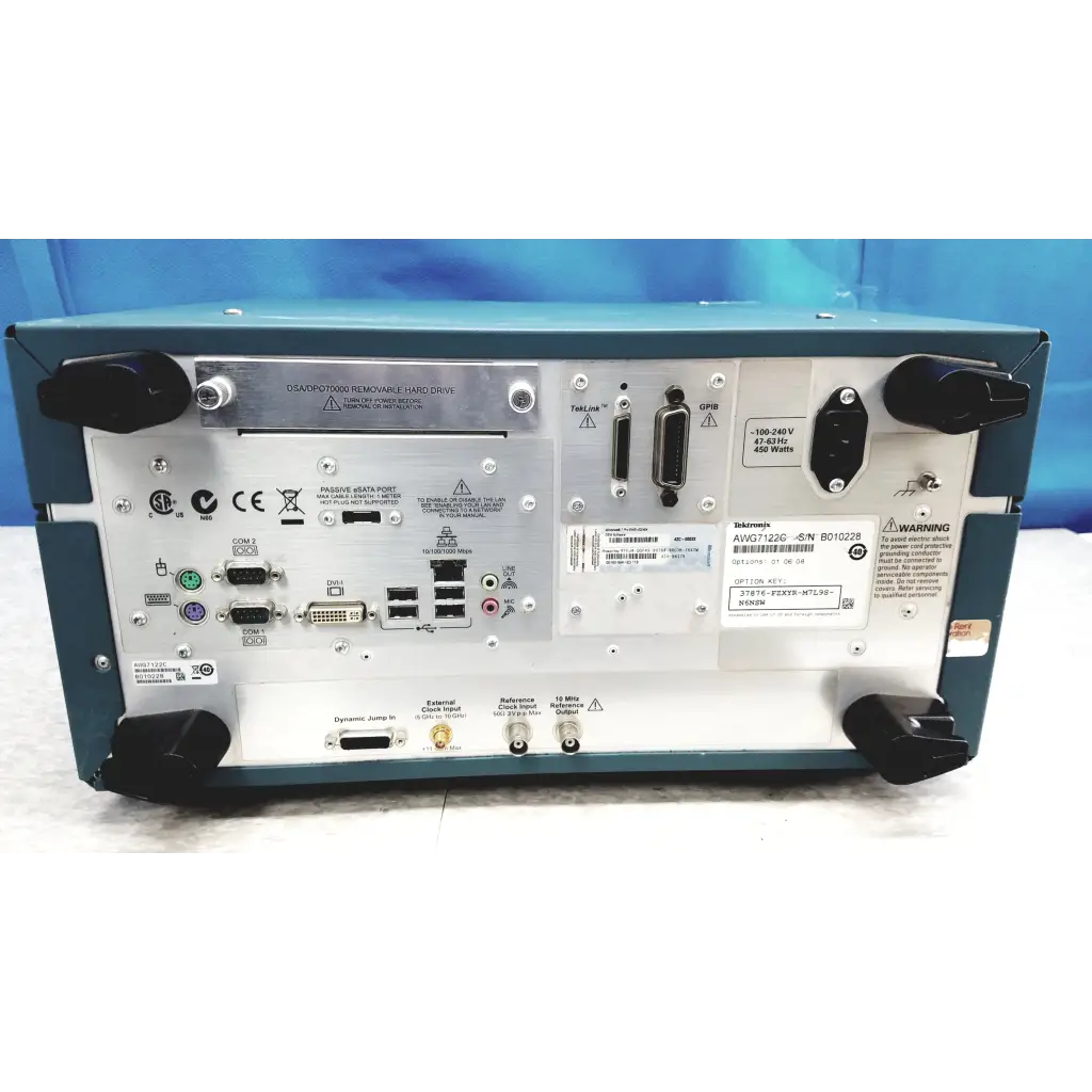 Teal tektronix awg7122c arbitrary waveform generator back panel with silver ports and connectors for waveform testing