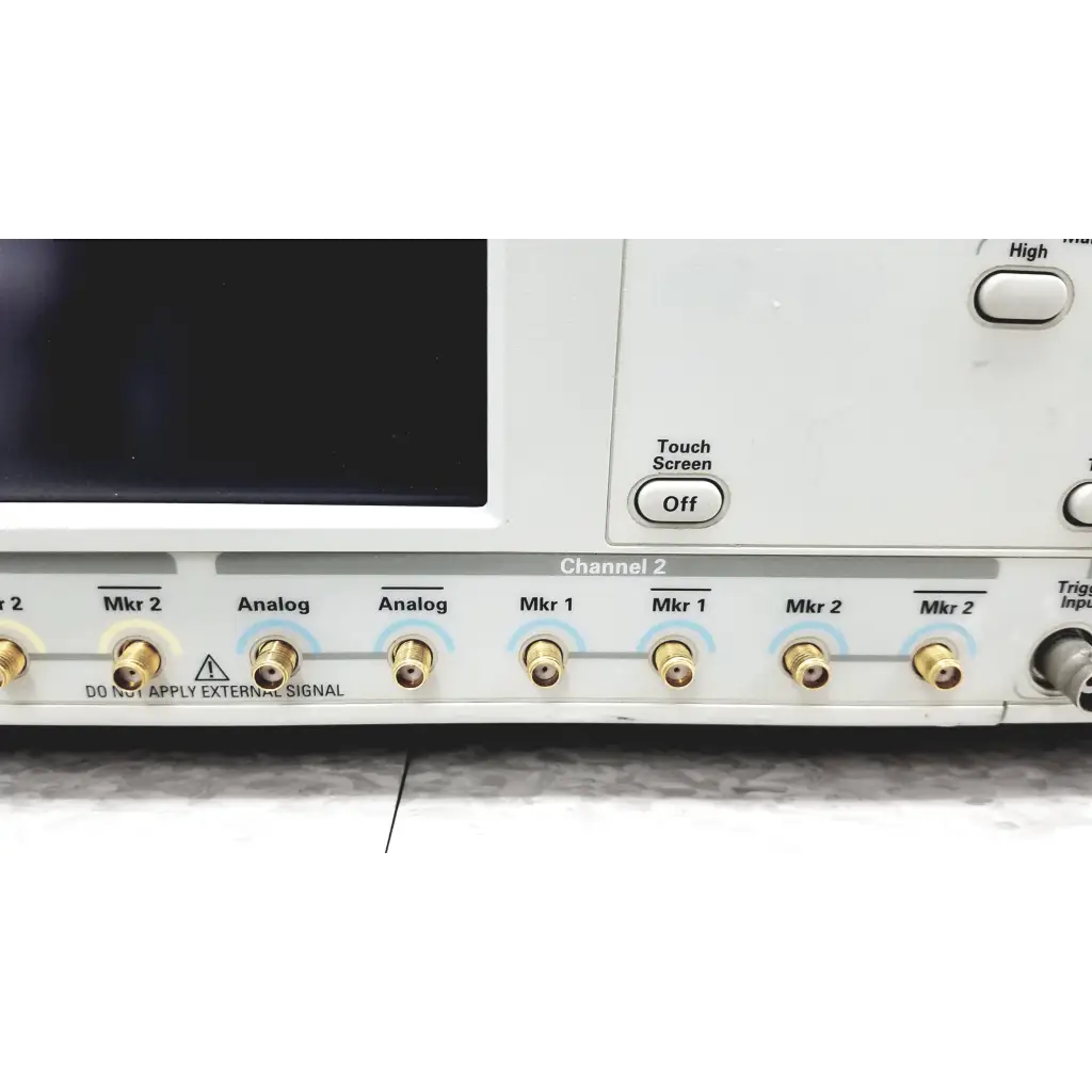 White Tektronix awg7122c arbitrary waveform generator with gold bnc connectors labeled for channels and markers