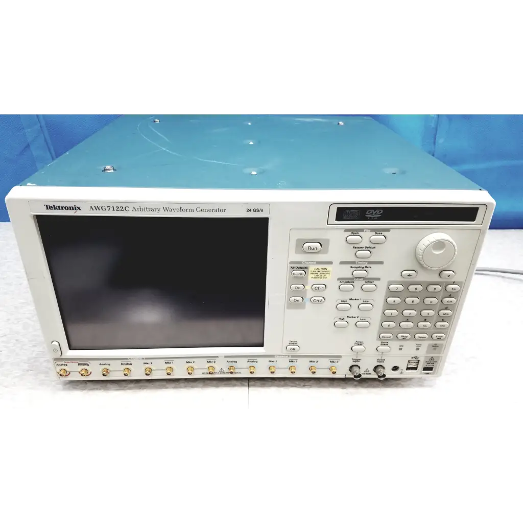 White tektronix awg7122c arbitrary waveform generator with black screen gold input connectors and multiple control buttons