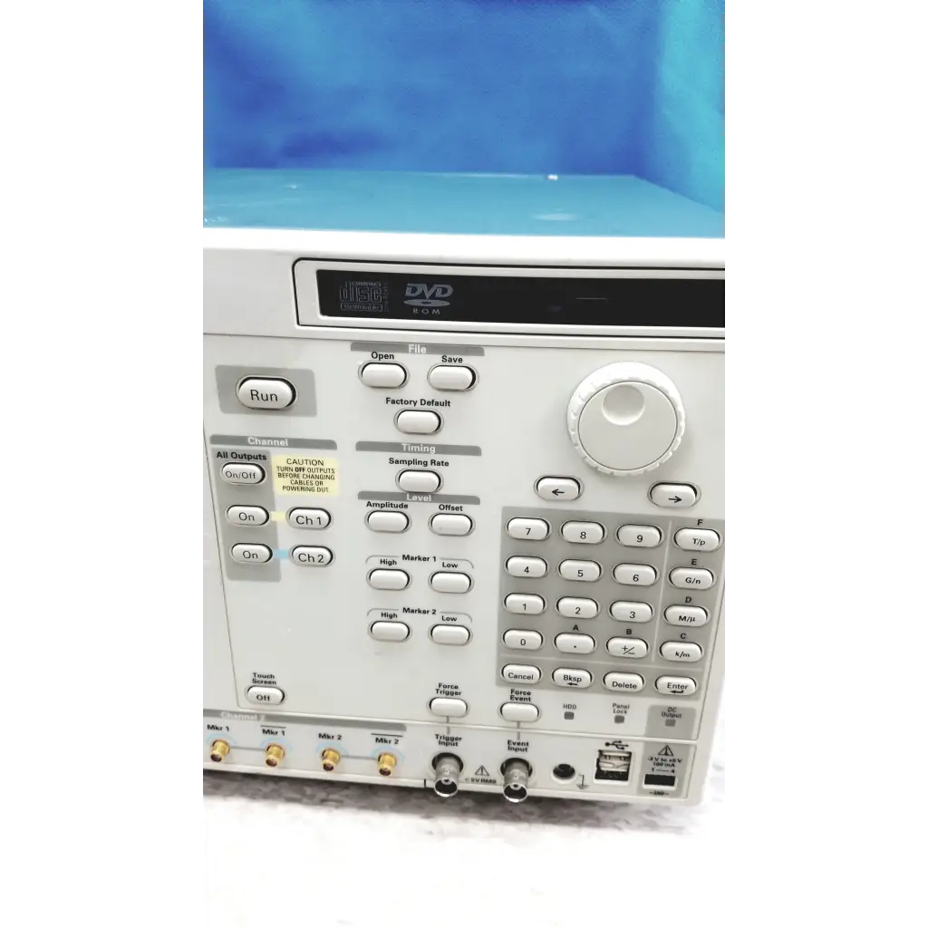 White tektronix awg7122c arbitrary waveform generator with digital display buttons and knobs for signal analysis