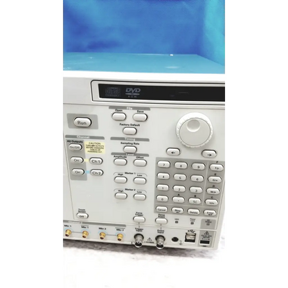 White tektronix awg7122c arbitrary waveform generator with digital display buttons and knobs for signal analysis