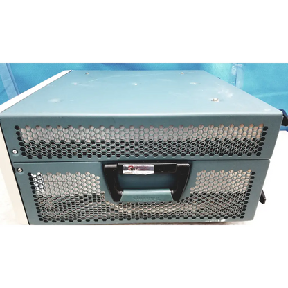 Teal-colored metal server rack with black handle and hexagonal ventilation grilles on tektronix awg7122c arbitrary waveform generator