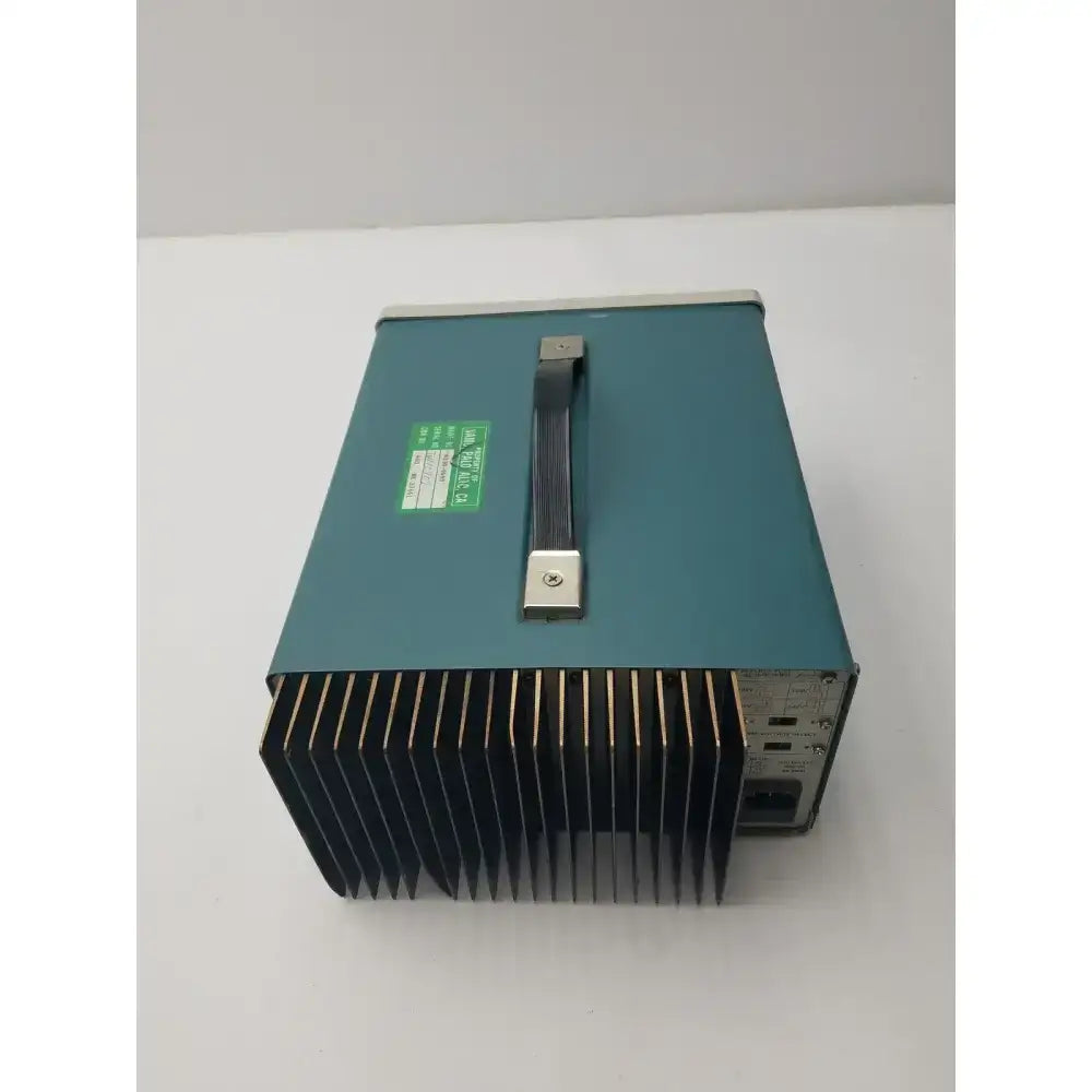 Teal-colored tektronix ps280 triple output power supply with black ribbed heat sink and silver handle metal casing