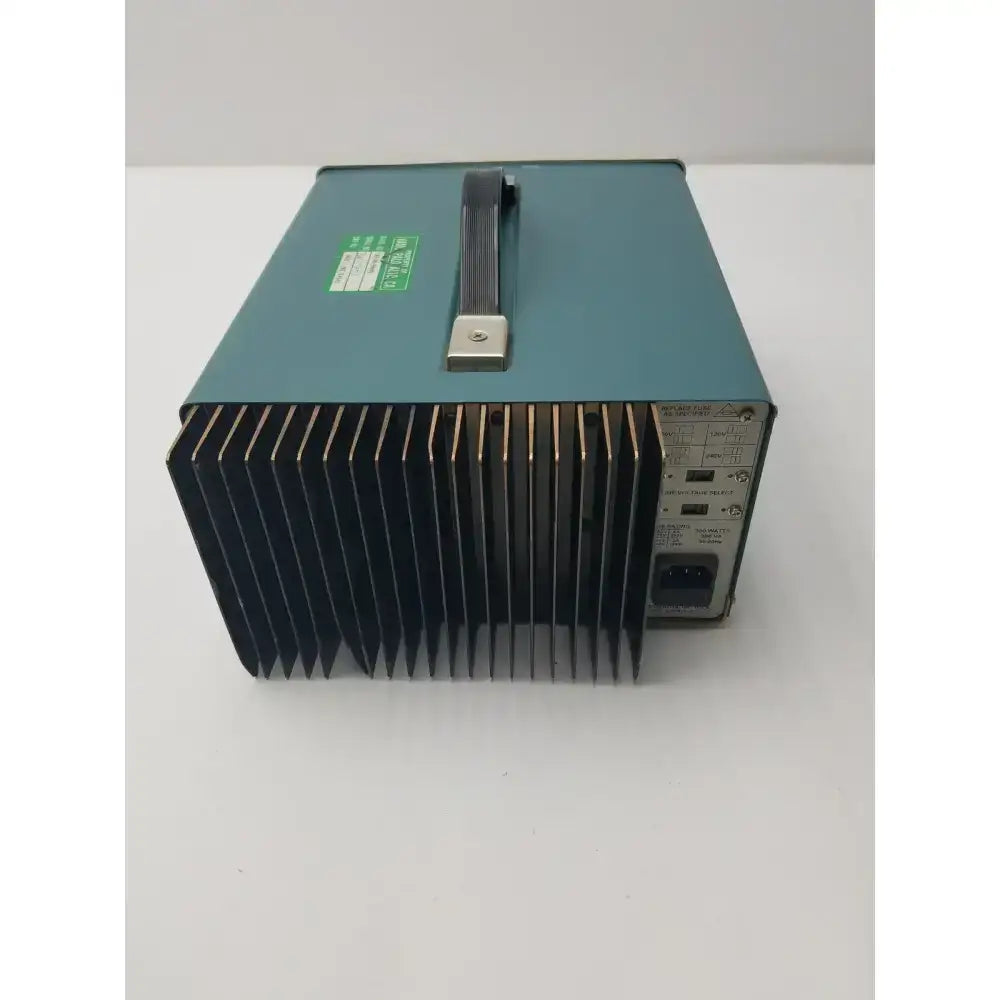 Teal industrial power supply with black heat sink and silver handle tektronix ps280 triple output dc power supply