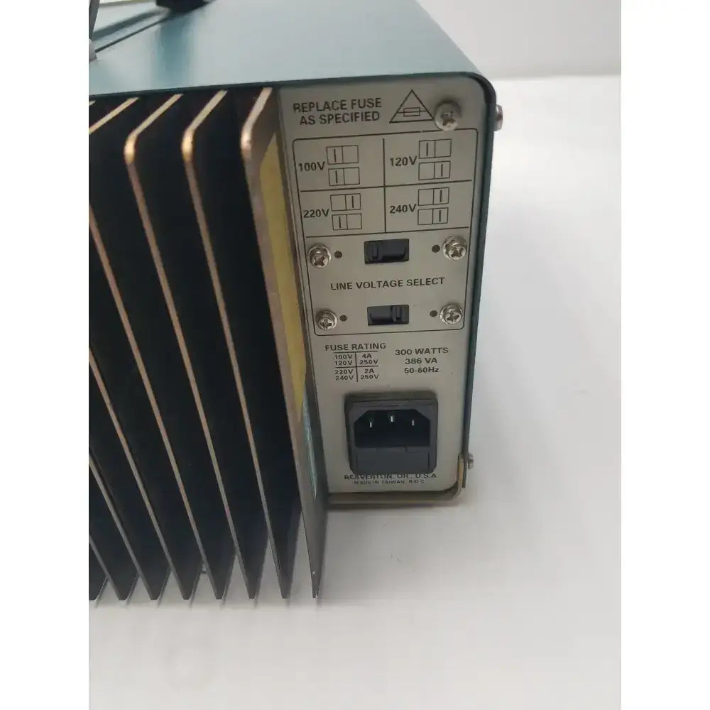 Black and silver tektronix ps280 triple output power supply with ribbed heat sink voltage switches and iec c13 input port
