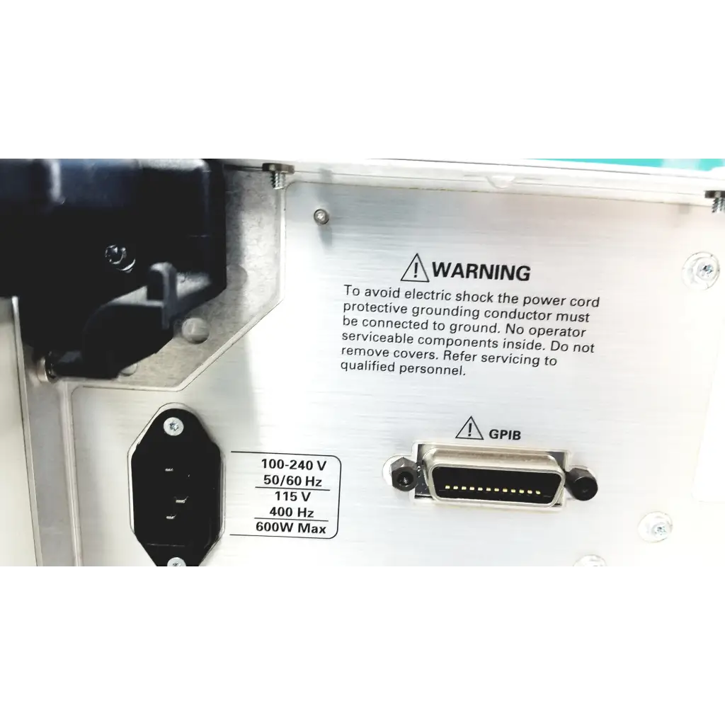 Back panel of silver metallic tektronix rsa6106a real-time spectrum analyzer with black power socket and gpib connector