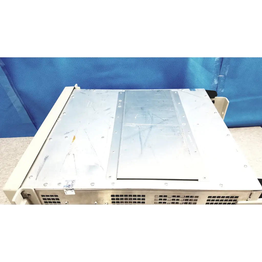 Beige tektronix rsa6106a real-time spectrum analyzer with silver metal panel and ventilation grilles on the back side
