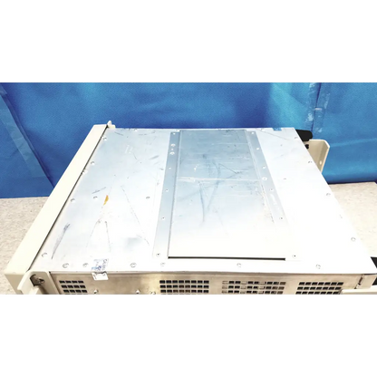 Beige tektronix rsa6106a real-time spectrum analyzer with silver metal panel and ventilation grilles on the back side