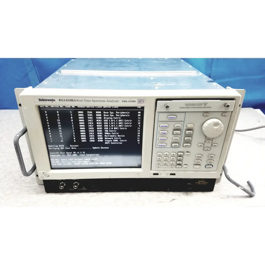 Beige tektronix rsa6106a real-time spectrum analyzer with black screen showing technical data and keypad panel
