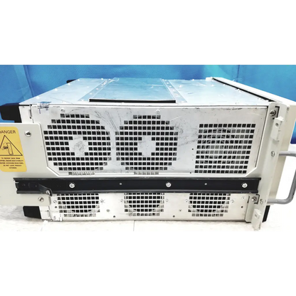 Silver metallic tektronix rsa6106a real-time spectrum analyzer server rack with black grilles and yellow warning label side view