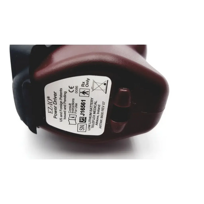 Maroon teleflex arrow ez-io 9058 power driver intraosseous with white label showing serial number and regulatory markings