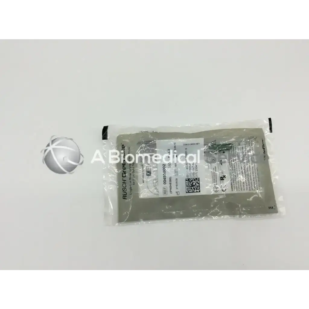 A gray sealed medical package of teleflex rusch greenlite metal laryngoscope blade for fiber optic systems