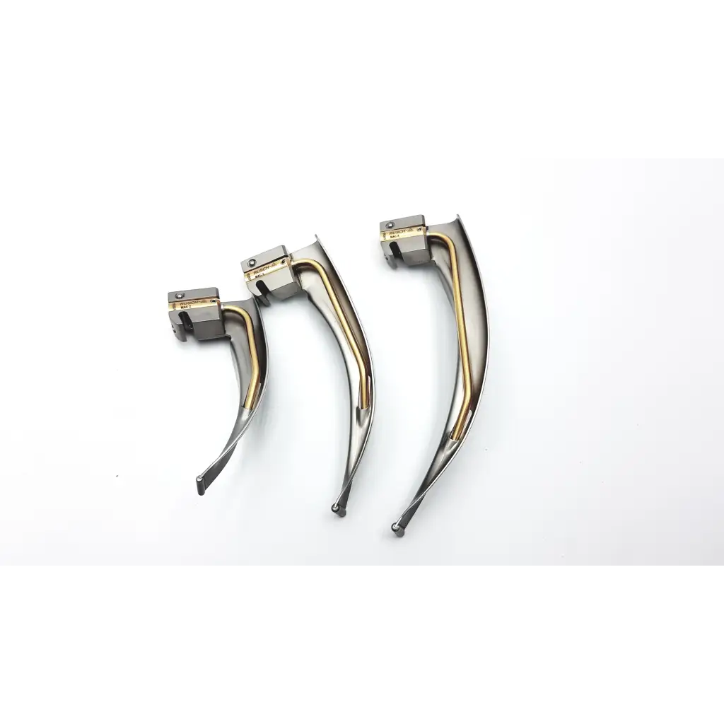 Three metallic teleflex rusch mri laryngoscope handles with curved silver blades and gold conditional fiber optic components