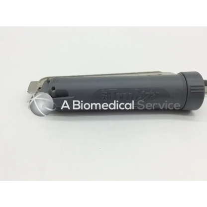 Gray cylindrical medical device with textured cap and metallic attachment by teleflex rusch trulite secure 004670001
