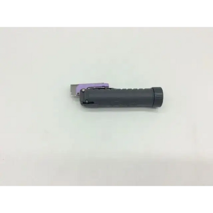 Black plastic handled teleflex trulite laryngoscope handle with purple metallic trigger and silver cutting blade