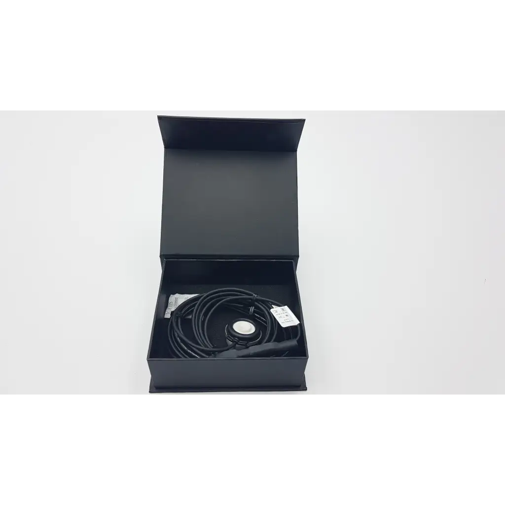 Black coiled cable with circular metallic connector in sleek box for telehealth technologies pcp-usb stethoscope use