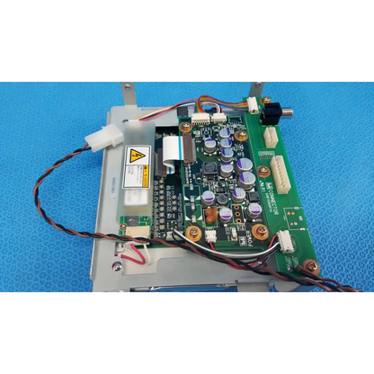 Green circuit board with silver and purple capacitors and connectors on gray metal chassis for teli lcd monitor control board