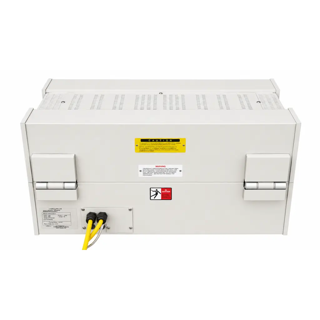 White industrial power supply unit with yellow warning label and black cables at back of biomed certified lindberg blue htf55347c furnace