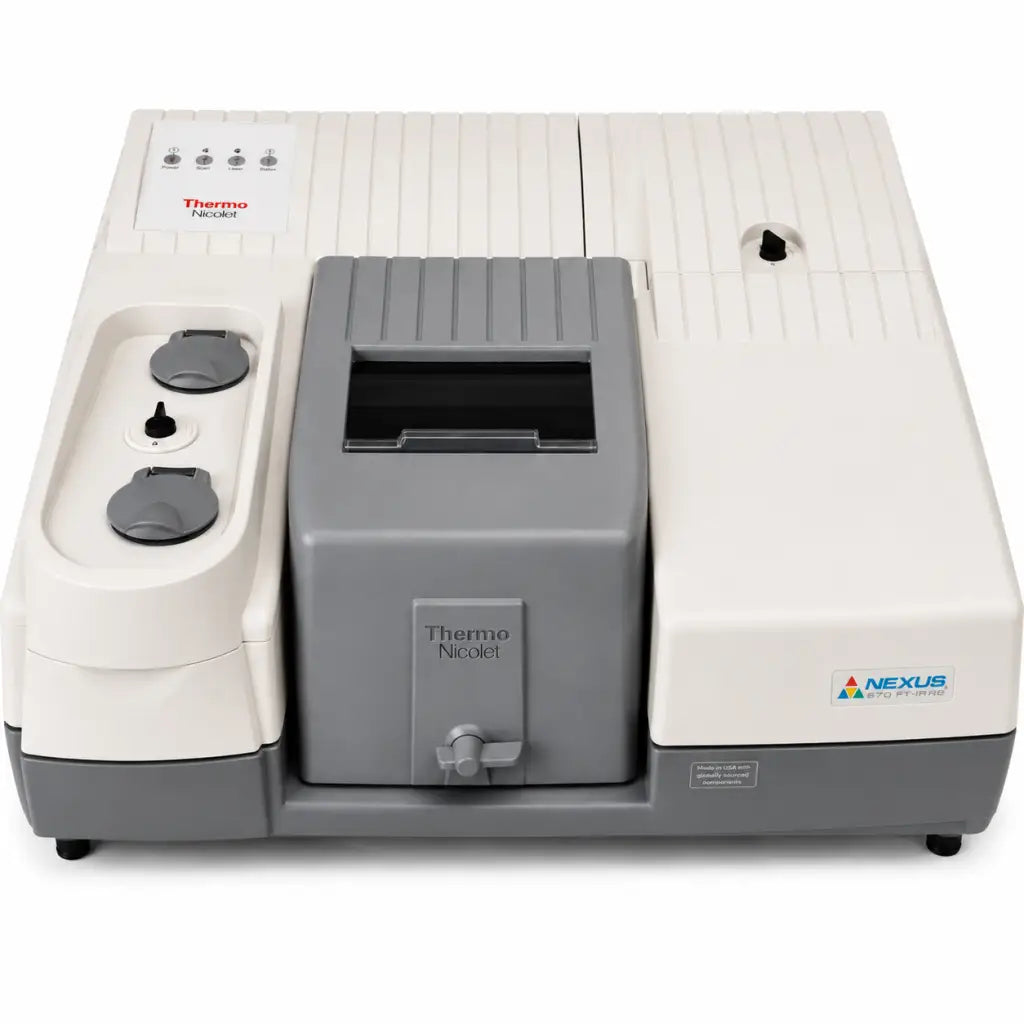 Gray and white thermo nicolet nexus 670 ft-ir spectrometer with ribbed housing and control panel on the left side
