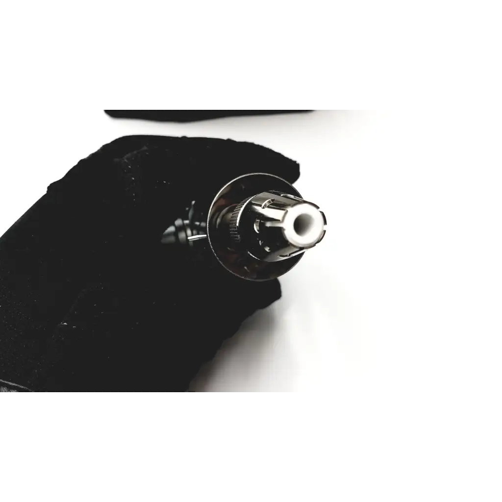 Thermo scientific apci probe featuring a shiny chrome-finished vape pen with a white ceramic mouthpiece