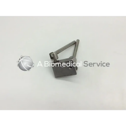 Silver metallic thompson 41910 power rail clamp with articulated arm and rectangular base for laparoscopic instruments