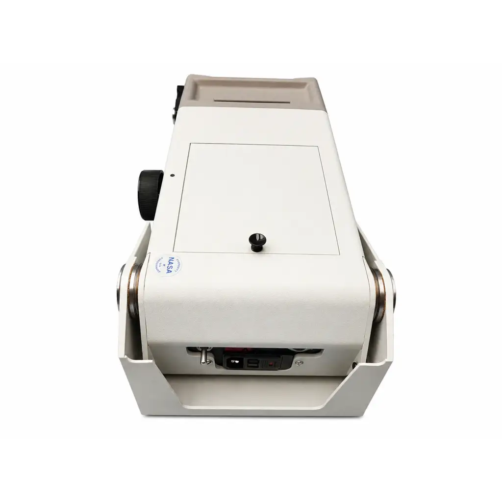 White nasa-branded currency counting machine with black knobs and metallic rollers beside biomed certified titmus 2s vision screener