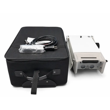 White and gray titmus 2s vision screener with black power cord and plastic-wrapped accessories in black carrying case biomed certified
