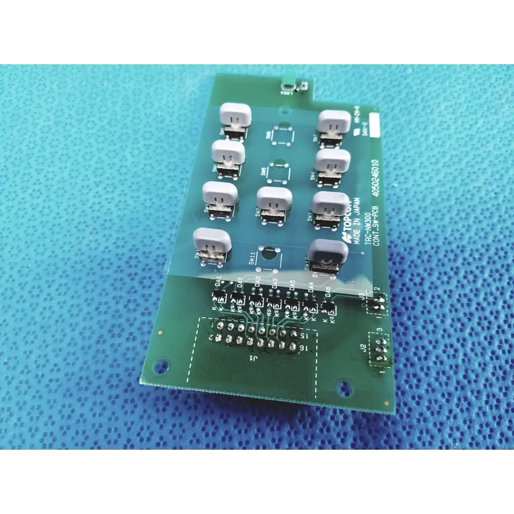 Green control switch pcb board with white connectors and black solder points marked topcon model 4050246010