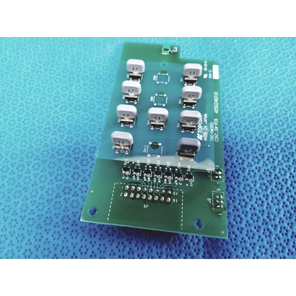Green control switch pcb board with white connectors and black solder points marked topcon model 4050246010