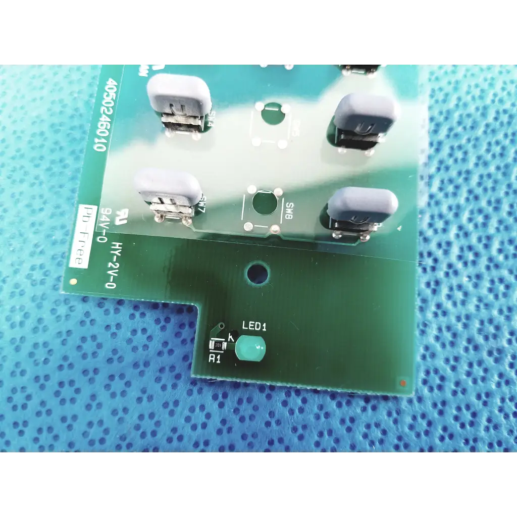 Green control switch pcb board by Topcon featuring four gray usb ports and a green led labeled led1