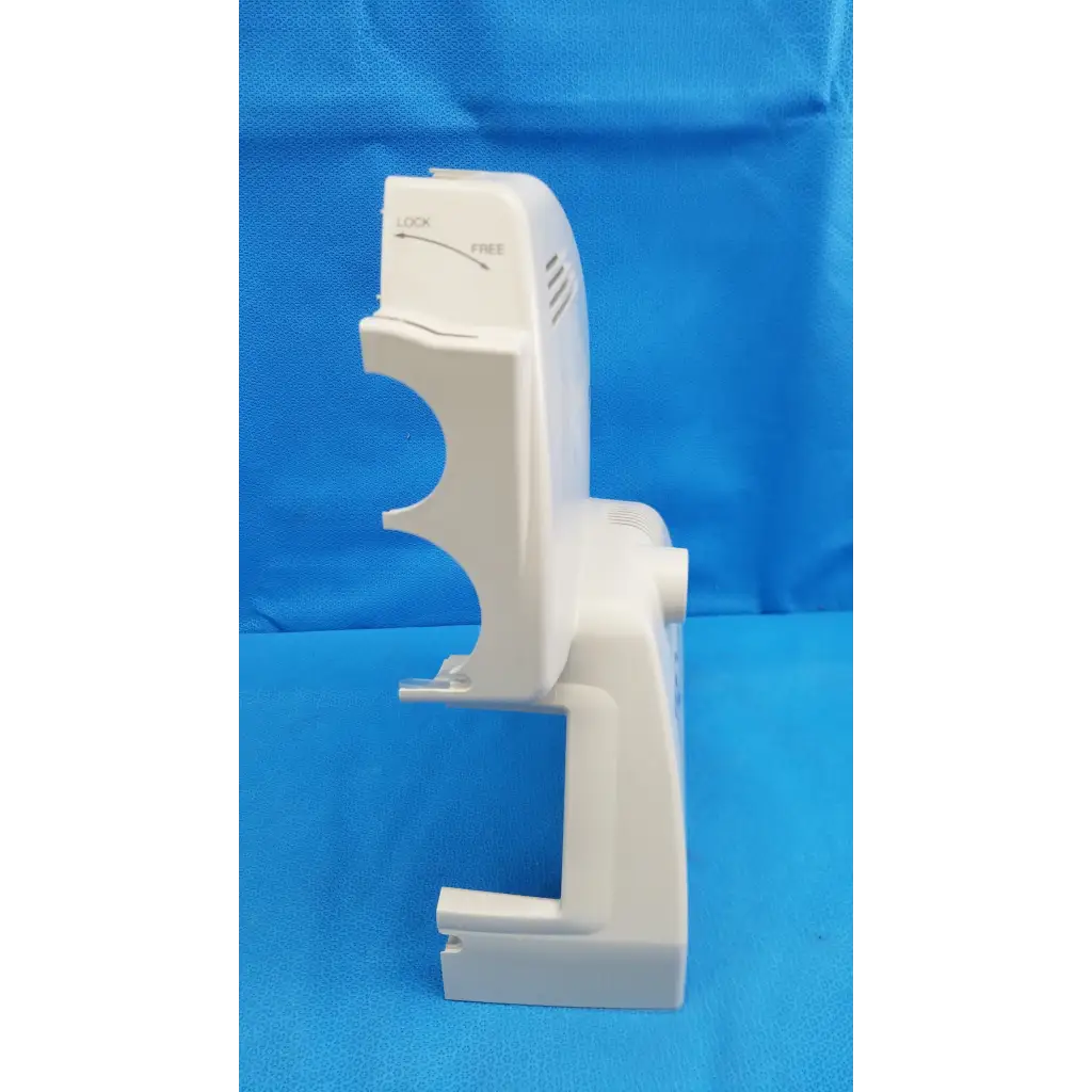 White plastic housing body shroud tray with molded slots for sheets on the back side of trc-nw6s retinal camera