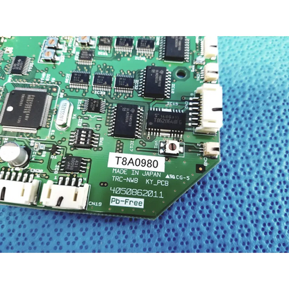 Green pcb control circuit board with black integrated circuits labeled t8a0980 made in japan for topcon trc-nw8