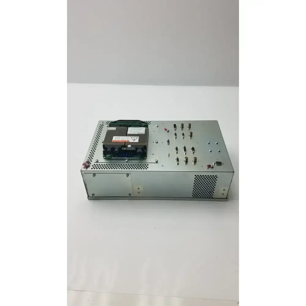 Silver metallic toshiba high voltage power supply vp-33327 with perforated panels and black circuit board on top