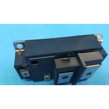Black rectangular igbt power module mg400j1us51 with metallic terminals and mounting holes for retinal camera use