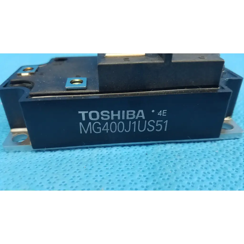 Black toshiba mg400j1us51 igbt power module with metallic mounts and blue label for retinal camera use
