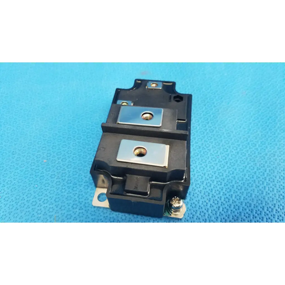 Black plastic mg400j1us51 igbt power module with silver metal plates and threaded holes for retinal camera use