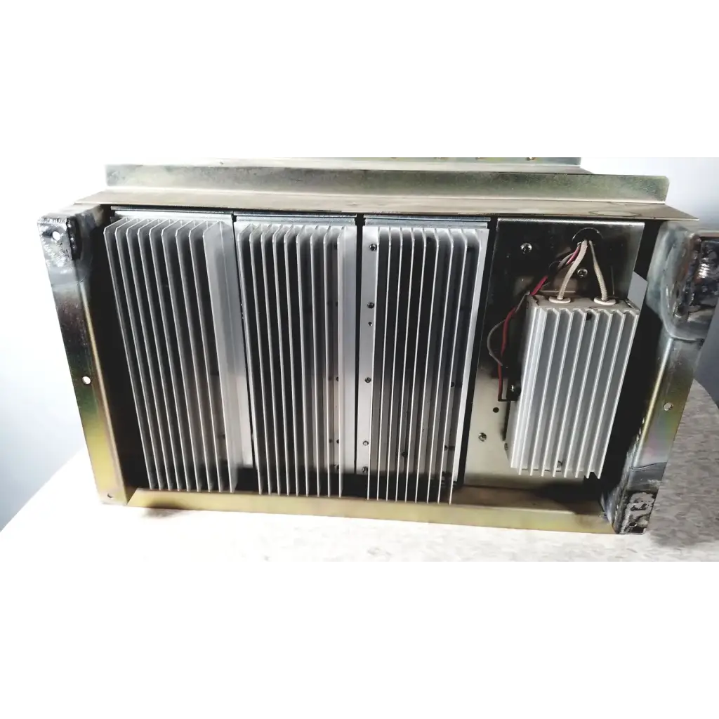 Silver-colored metal heat sink with vertical fins and internal wiring on the toshiba ra power rad92-1008 power supply