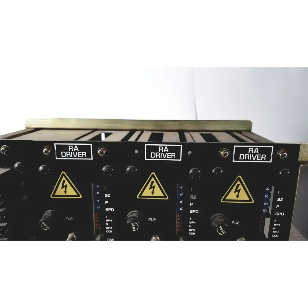 Black aviation ra driver modules with yellow lightning hazard symbols on labeled control panels of toshiba ra power rad92-1008 power supply back side