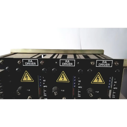 Black aviation ra driver modules with yellow lightning hazard symbols on labeled control panels of toshiba ra power rad92-1008 power supply back side