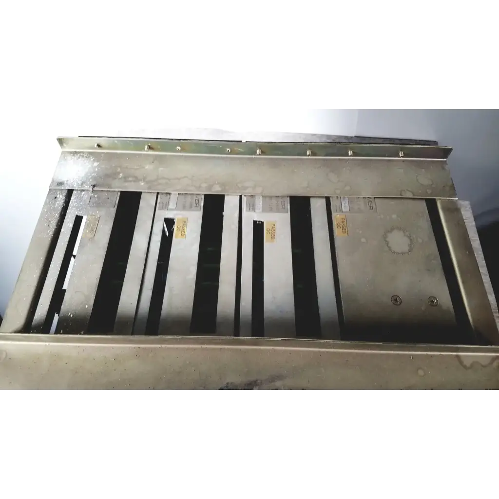 Industrial-grade metal ventilation grille with matte silver finish and vertical slats on toshiba ra power rad92-1008 power supply back side