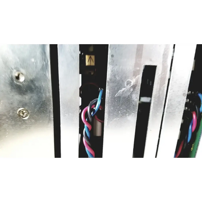Silver metallic vertical slats with visible screws and colorful wires on the back of toshiba ra power rad92-1008 power supply