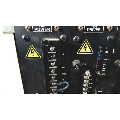 Black industrial control panel of toshiba ra power rad92-1008 dc power supply with yellow warning labels and terminal blocks