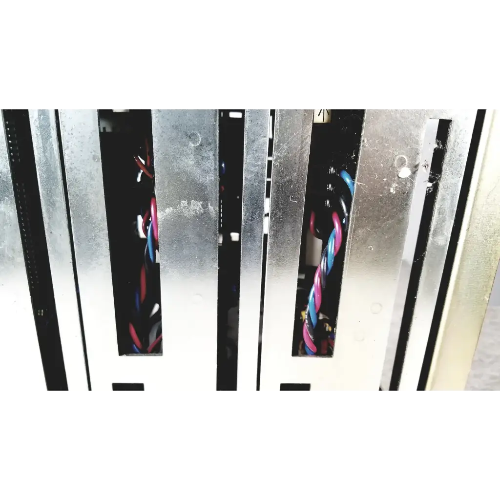 Silver metallic server rack with vertical slots and colorful twisted cables showing the back side of toshiba ra power rad92-1008 power supply