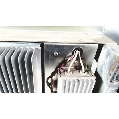 Silver metallic heat sink with vertical fins and wiring harnesses on the back of toshiba ra power rad92-1008 power supply