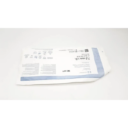 White and light blue sterile surgical glove package with printed labeling for tracheal tube cuffed murphy eye 7.0mm